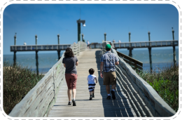 mother and son walking on pier